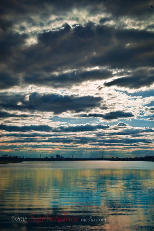 Clouds Engulf Lake Near City